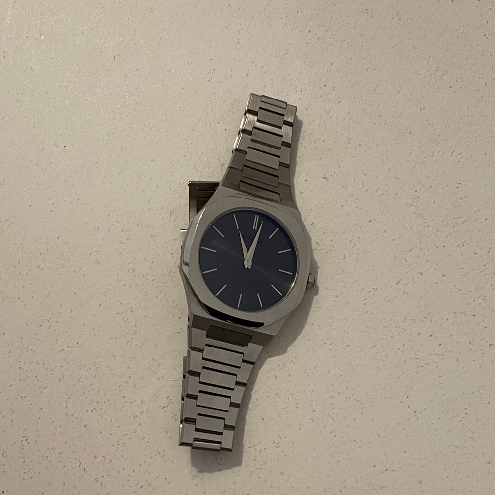 Silver Watch with Blue D1 Milano watch retails $400